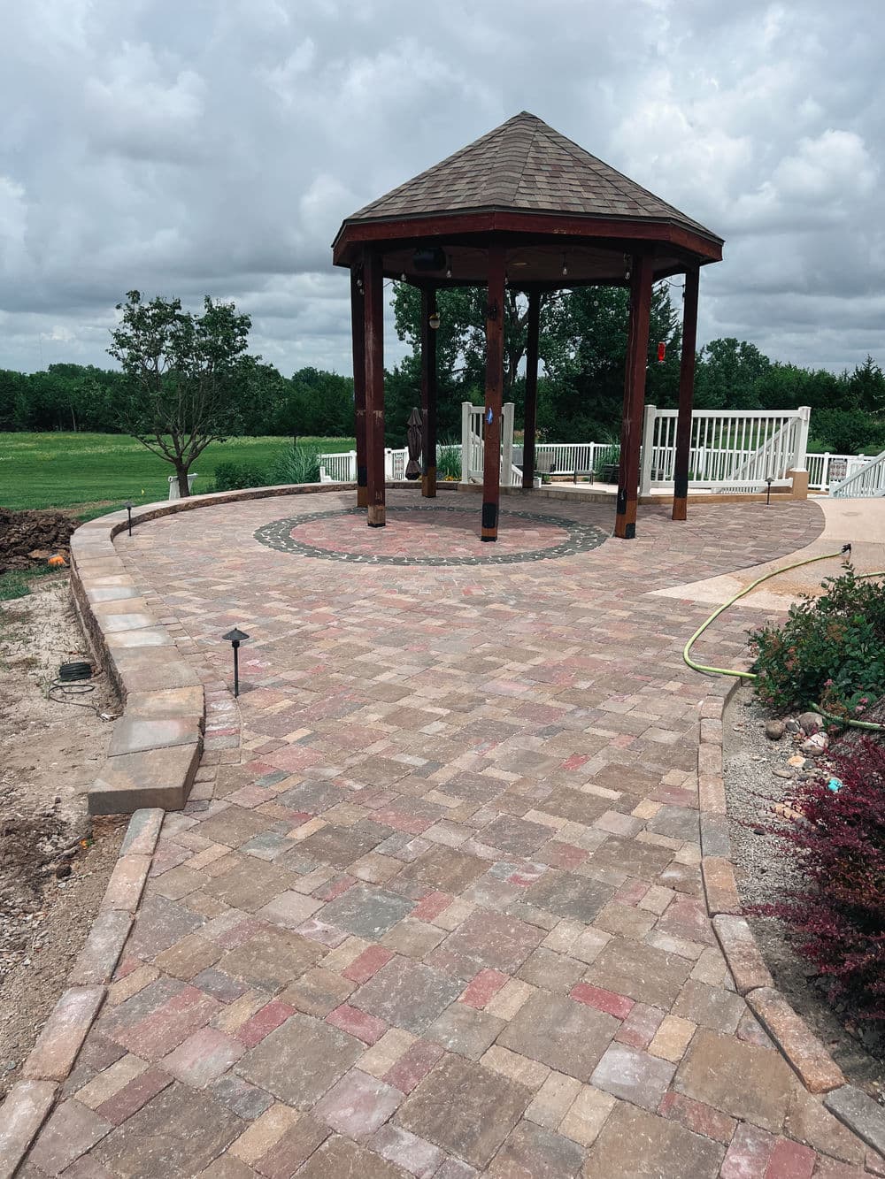 Gallery photos for Three-Tier Paver Patio with Custom Circle Design in Topeka: Image #2