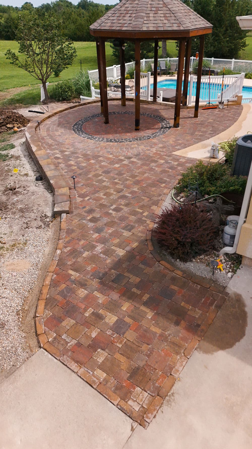 Three-Tier Paver Patio with Custom Circle Design in Topeka image